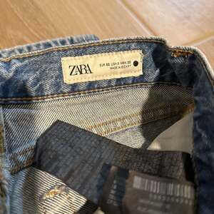 Zara High Rise Distressed Mom Jeans in Light Blue